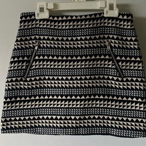 Glamorous woman’s polyester skirt, zipper back, blue, black, beige pattern, S